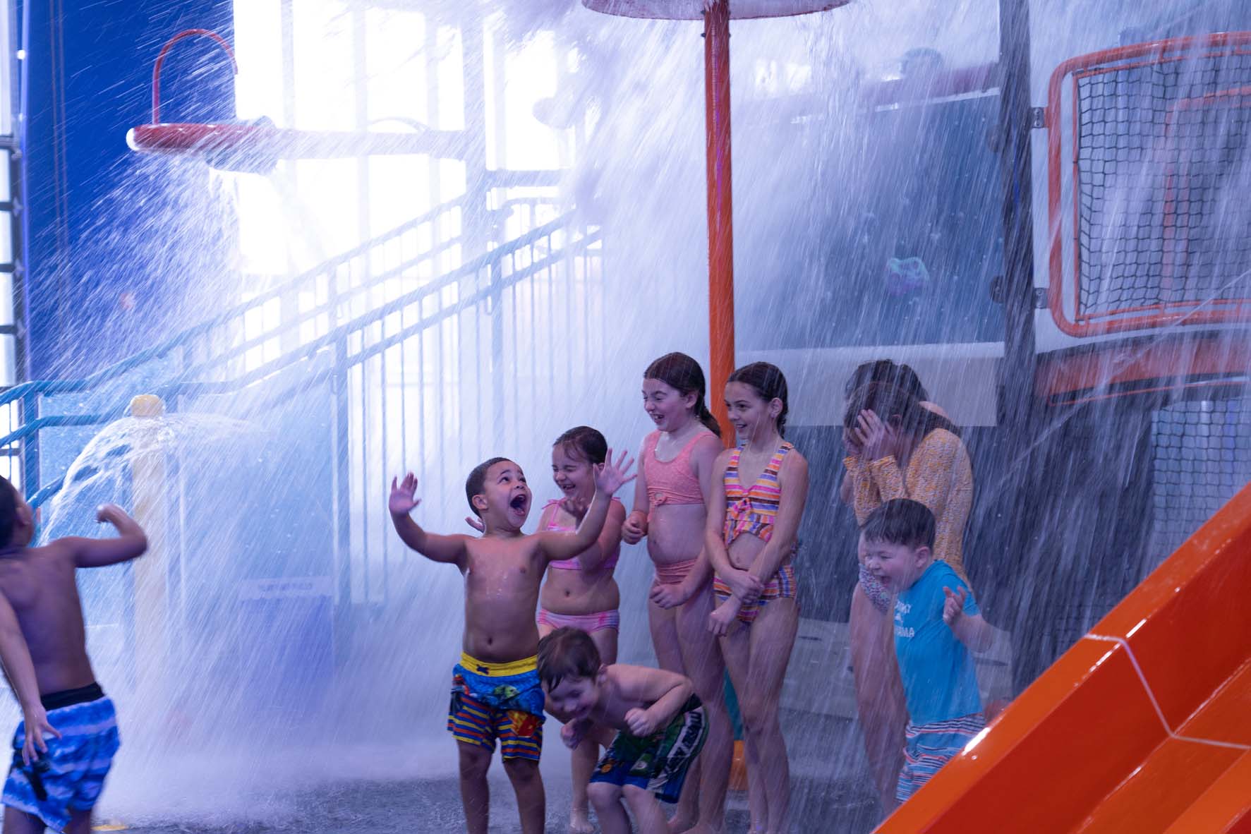 Children enjoying the water features at Blast Off Bay