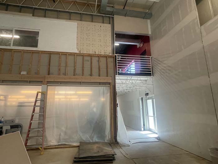 Construction at Lincoln Racquet Club with an overlook upstairs