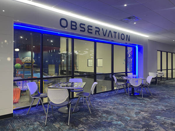 Observation area with tables and seating at Blast Off Bay