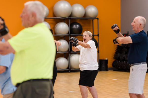 A woman in our senior fitness class regaining strength and balance